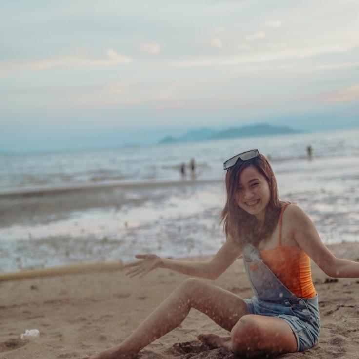 Avery Chen, Lead Design Curator at SignalDeltaShore, reviewing corporate floral arrangements